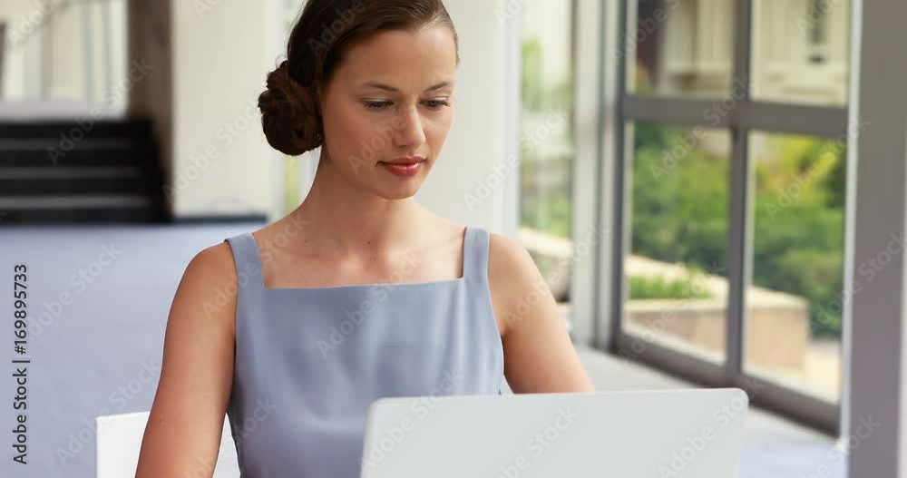 Female business executive talking on mobile phone Female business executive talking on mobile phone