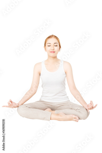 Pretty slim smile woman fitness Yoga exercises .A asian girl practicing yoga as a form of relaxation ,studio full length shot , isolated on white