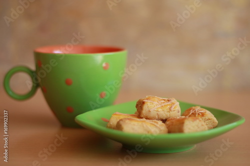 Kastengel or Dutch Indonesian cheese stick cookies and a cup of tea