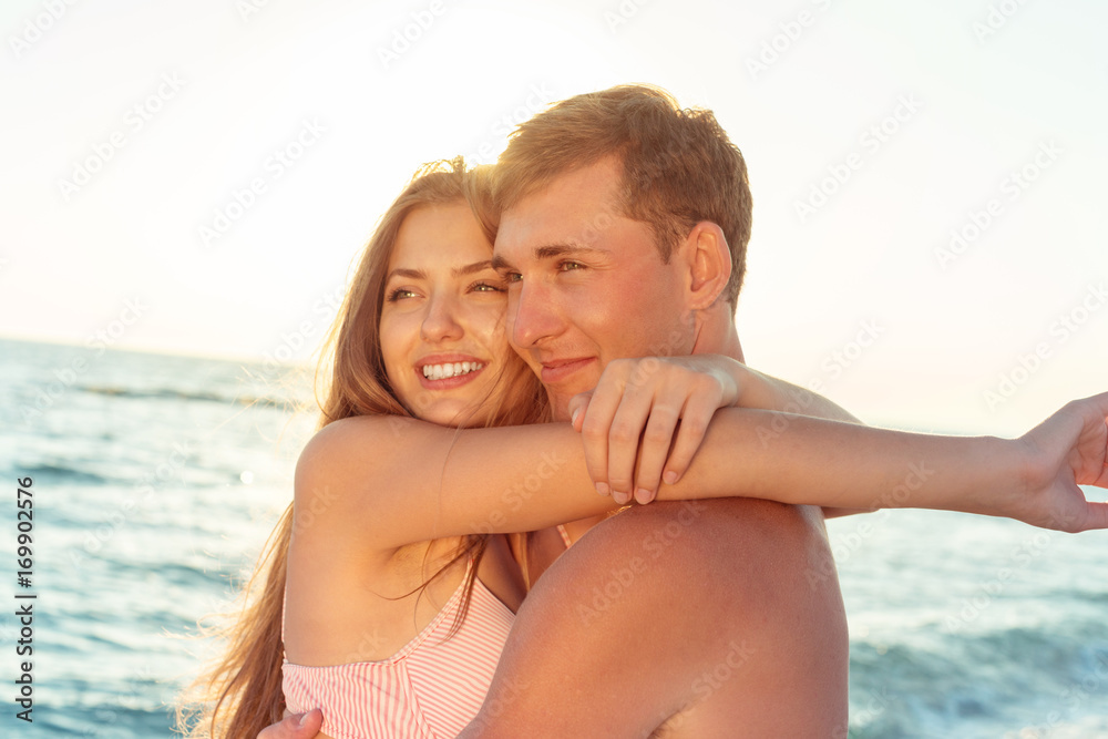 Portrait of a beatiful loving couple having fun at the beach Portrait of a beatiful loving couple having fun at the beach