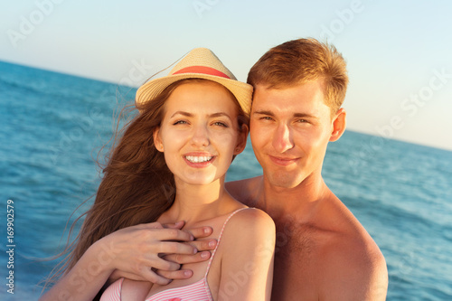 Portrait of a beatiful loving couple having fun at the beach