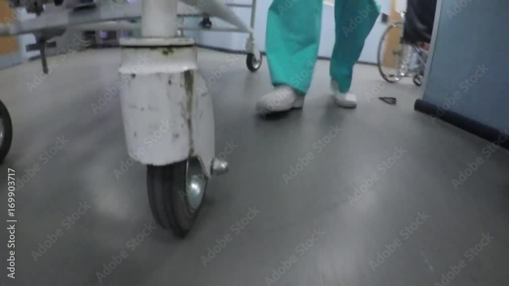 Medics pull the stretchers with sick patient Medics pull the stretchers with sick patient