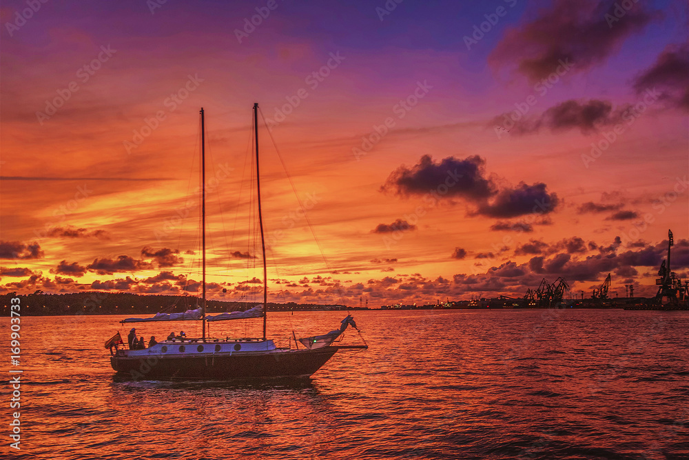 Fototapeta premium very beautiful colors in the evening sunlight shines on the ships in port