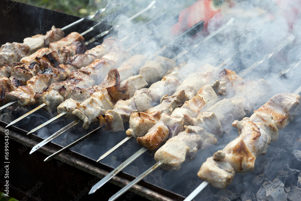 barbeque on the grill on skewers, pork, cooking meat