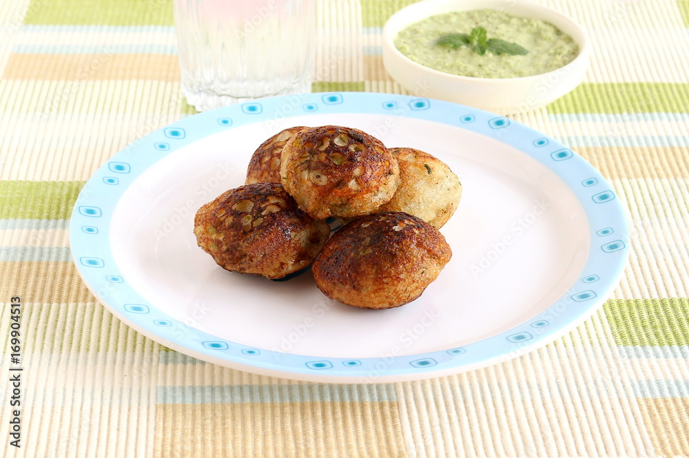Paddu, south Indian vegetarian food, is usually made from a batter of lentils and rice. Paddu, south Indian vegetarian food, is usually made from a batter of lentils and rice.