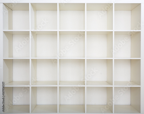 Empty bookshelf. White shelving