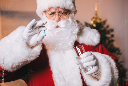 santa claus with medicines in hand