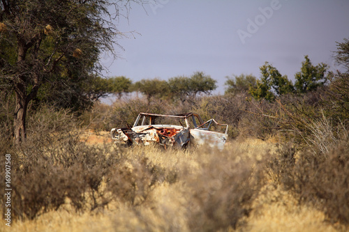 Rusty old car corroding in the desert in namibia