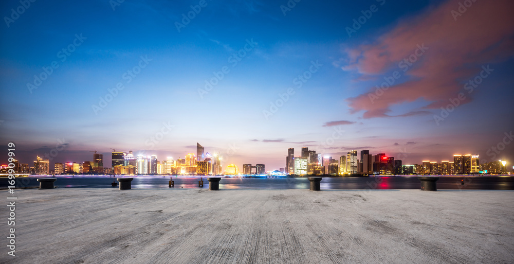 empty concrete floor with cityscape of modern city