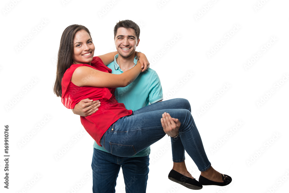 Boyfriend holding his girlfirend and smiling happy Boyfriend holding his girlfirend and smiling happy