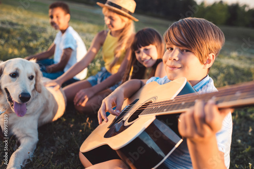 multiethnic teenagers with guitar