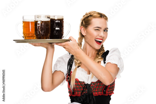 winking waitress with beer glasses photo