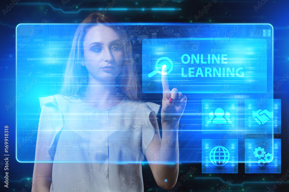 The concept of business, technology, the Internet and the network. A young entrepreneur working on a virtual screen of the future and sees the inscription: Online learning The concept of business, technology, the Internet and the network. A young entrepreneur working on a virtual screen of the future and sees the inscription: Online learning