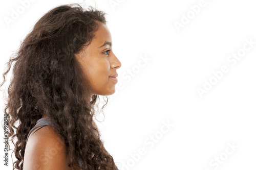 profile of a smiling, beautiful young dark-skinned woman