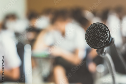 Microphone voice speaker with audiences in seminar classroom, lecture hall or conference meeting in educational business event for host, teacher, or coaching mentor