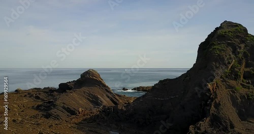 Flying around the rocky coast photo