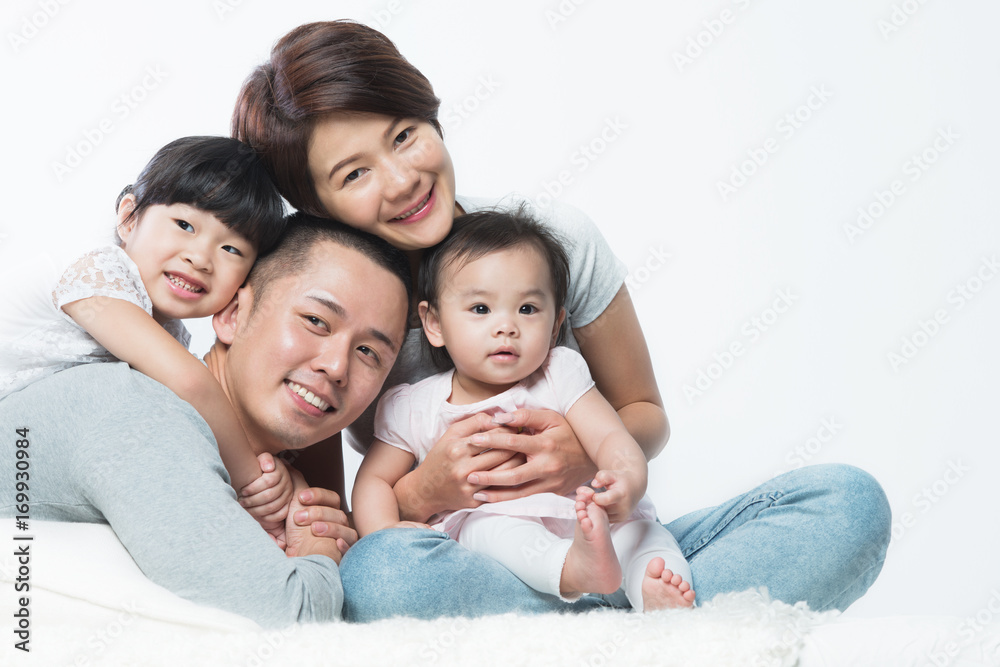 Young happy Asian family with kids