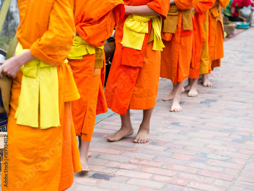 Alms giving ceremony in the early morning in Luang Prabang, Laos