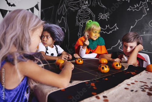 Kids playing games while halloween party 