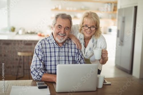 Senior couple using laptop at home © WavebreakMediaMicro