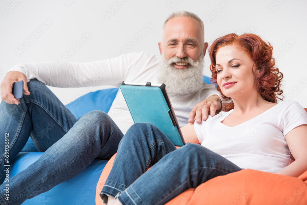 couple using digital tablet