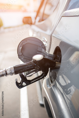 Gas pump nozzle in the fuel tank