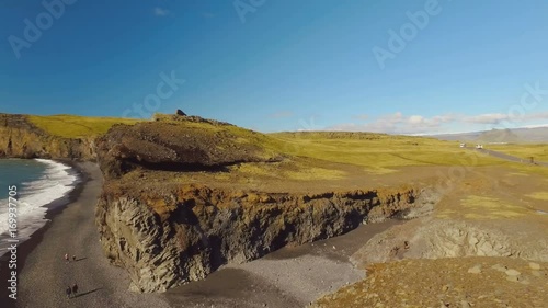 panorama from Dyrholaey cape from mountains to black sand beach and Atlantic ocean, sunny summer day photo