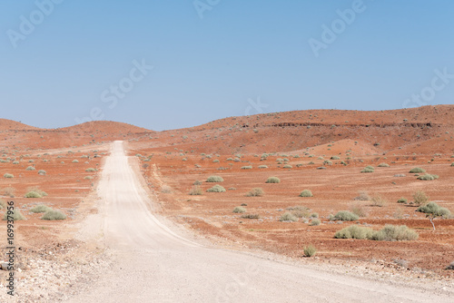 Orange-red, rocky Namib desert landscape at Dopsteekhoogte Pass