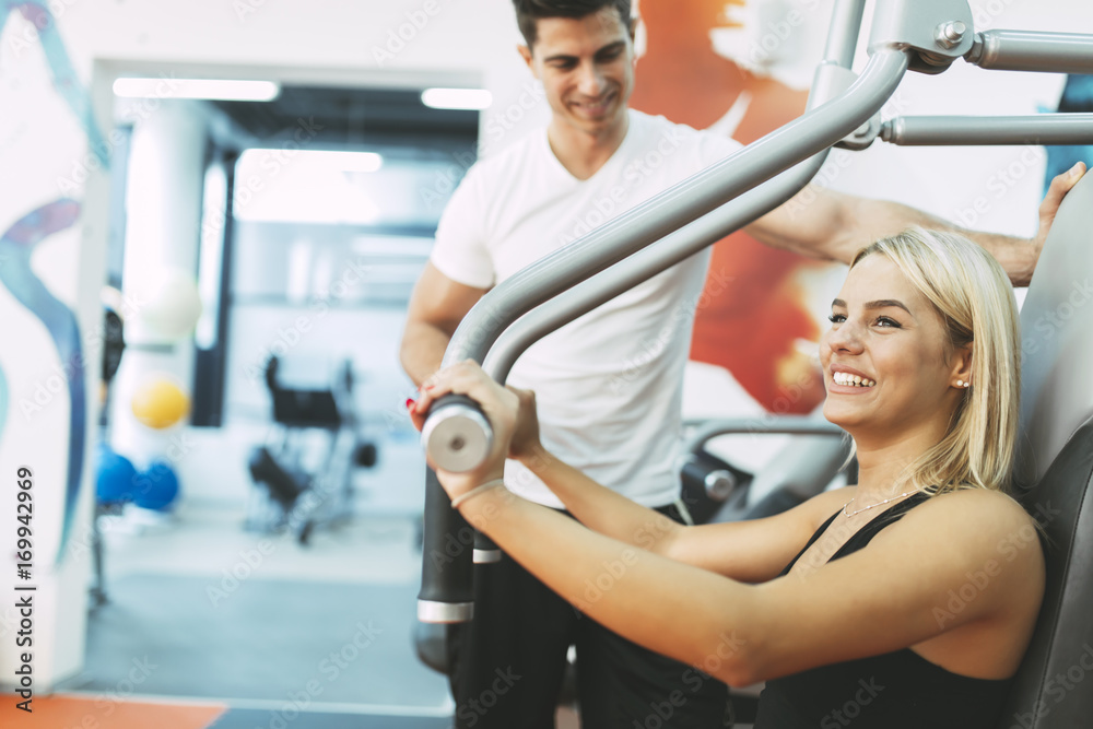 Fototapeta premium Beautiful woman exercising in gym