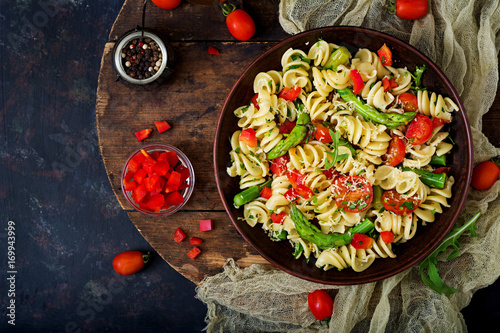 Salad - fusilli pasta with tomatoes, asparagus and sweet pepper photo
