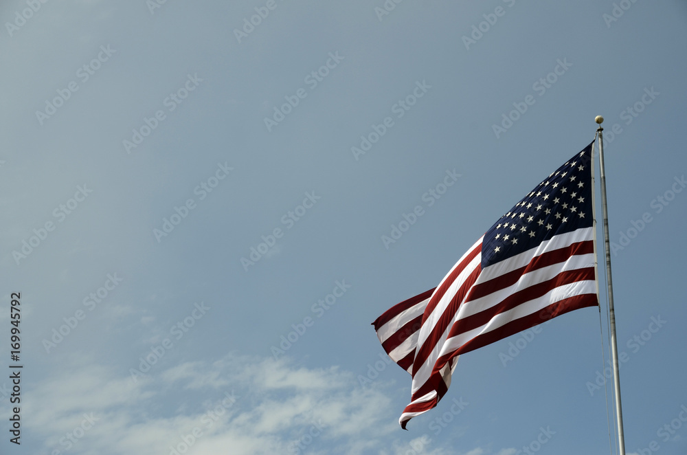 Obraz premium American flag on blue sky
