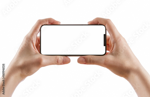 Young girl hand holding black smartphone on white clipping path inside. photo