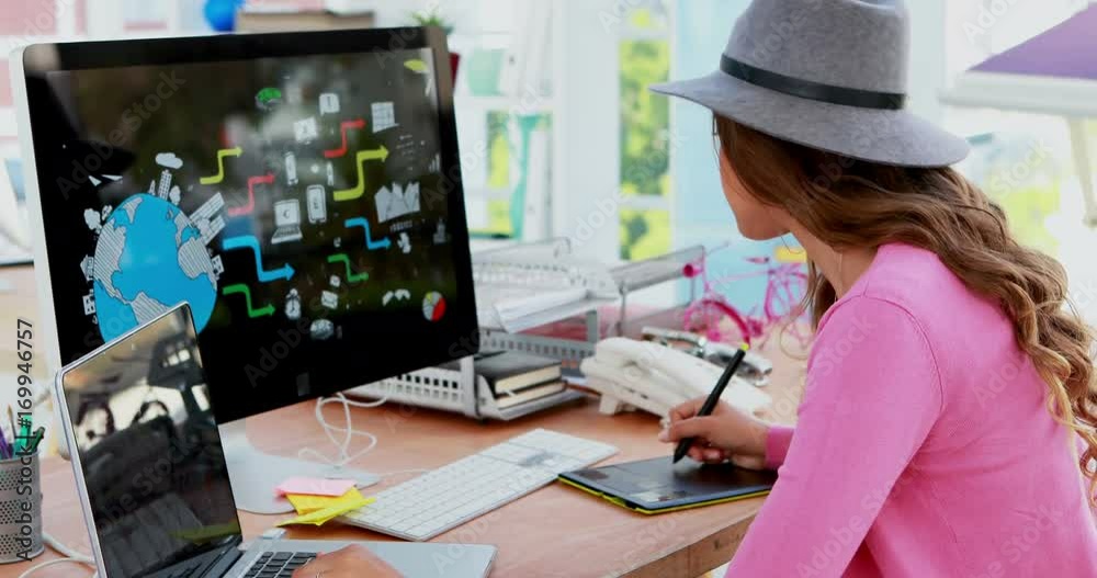 Female graphic designer working at desk 