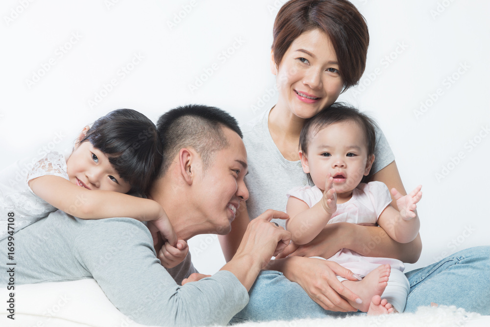 Young happy Asian family with kids Young happy Asian family with kids