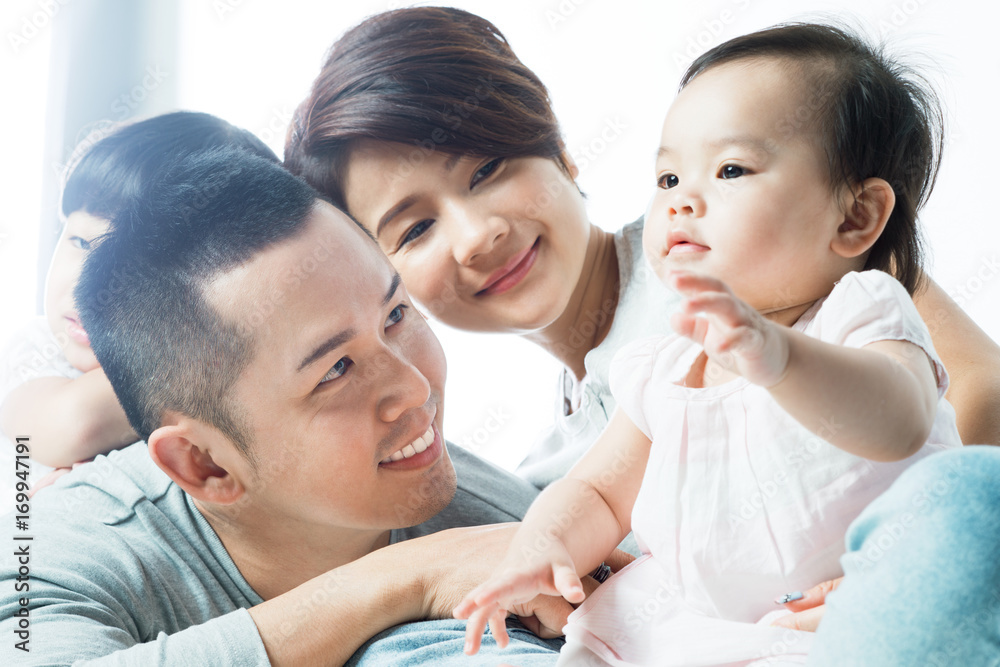 Young happy Asian family with kids Young happy Asian family with kids