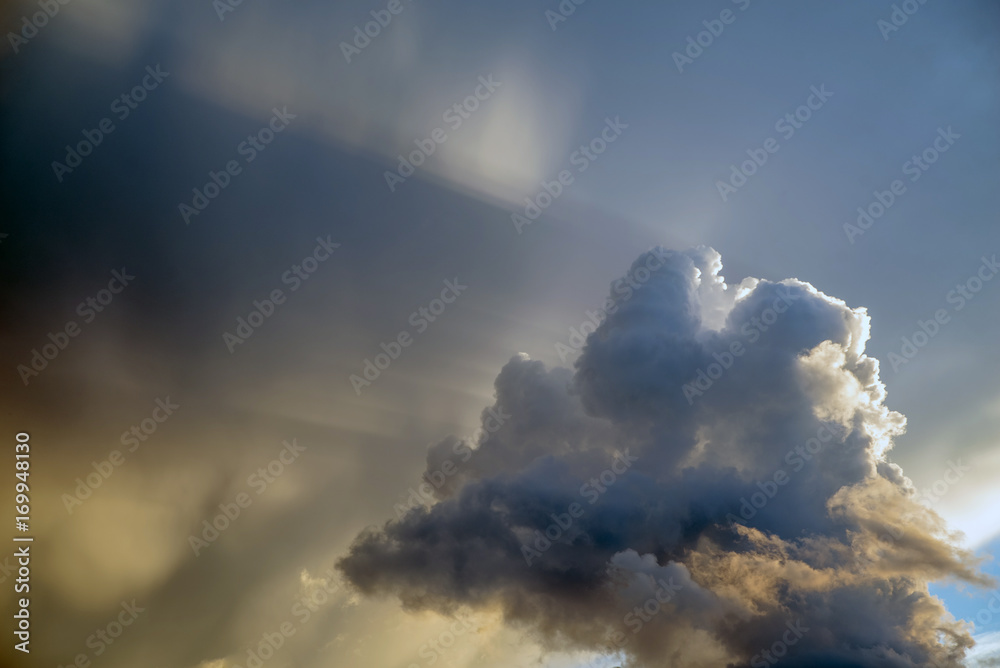 The rays of the sun at sunset make their way through the clouds The rays of the sun at sunset make their way through the clouds