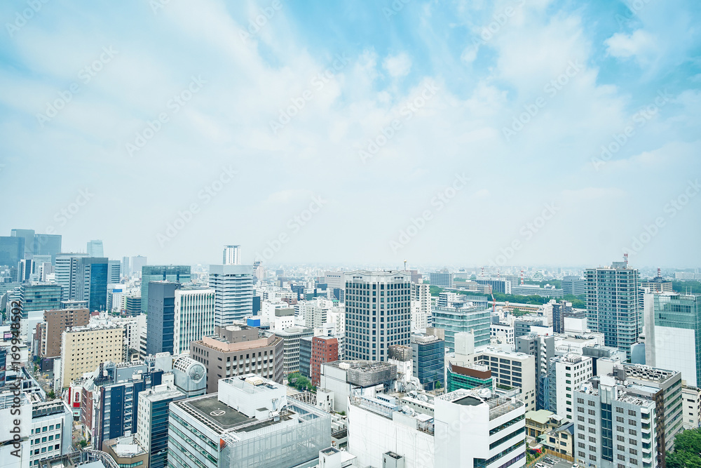Business concept for real estate and corporate construction - panoramic modern city skyline bird eye aerial view under dramatic cloud and morning bright blue sky on Nagoya TV Tower in Nagoya, Japan