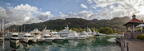 A few luxury yachts at the berth of Eden island, Seychelles photo