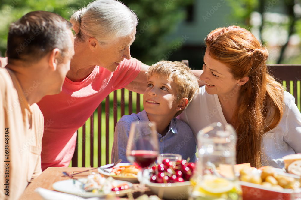 happy family having dinner or summer garden party happy family having dinner or summer garden party