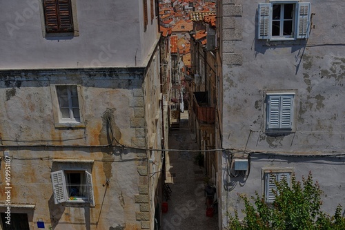 street between two old buildings  © Maciej