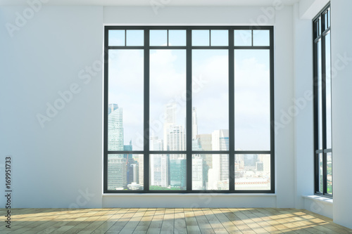 Bright unfurnished interior with city view