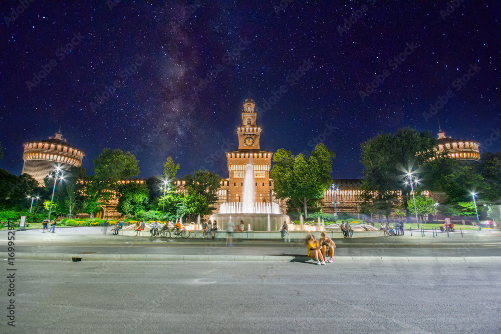 Fototapeta premium Sforza Castle (Castello Sforzesco) in Milan, Italy at night with milky.