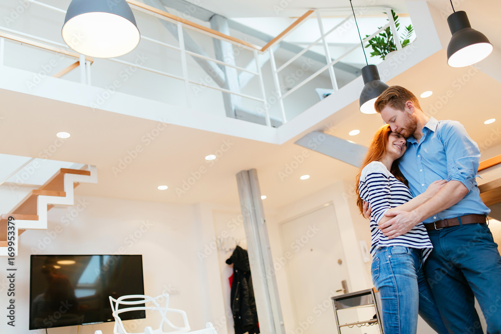 Couple enjoying their new luxurious home Couple enjoying their new luxurious home