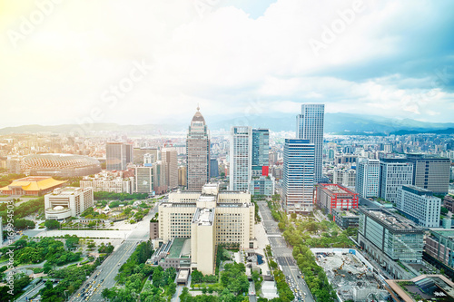 Business concept for real estate and corporate construction : panoramic modern city bird eye view with dramatic sunrise and morning blue sky from 101 building in Taipei, Taiwan
