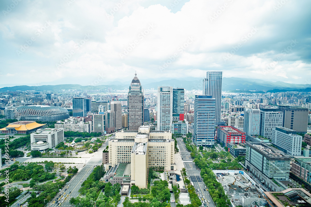 Business concept for real estate and corporate construction : panoramic modern city bird eye view with dramatic blue sky from 101 building in Taipei, Taiwan
