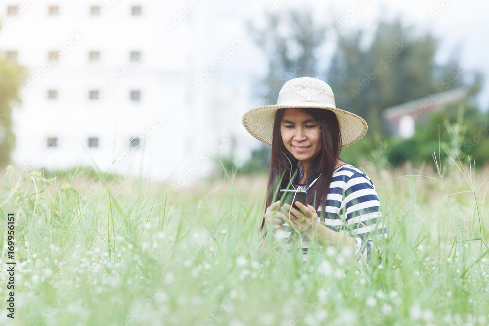 Beautiful woman sitting at grassland. Beautiful woman sitting at grassland.