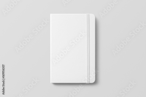 Blank photorealistic notebook mockup on light grey background.  photo