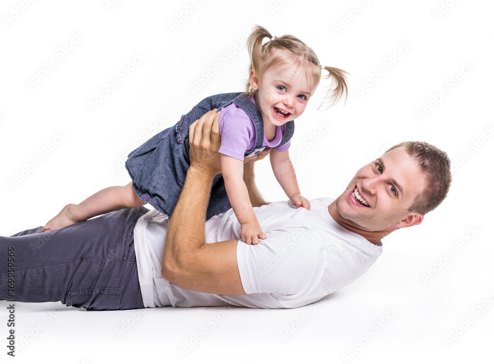 Father and daughter lay on ground having fun Father and daughter lay on ground having fun