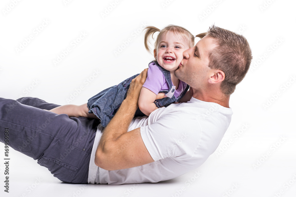 Father and daughter lay on ground having fun Father and daughter lay on ground having fun