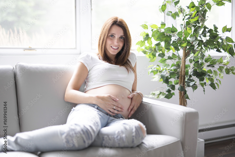 pregnant woman with her belly over white background pregnant woman with her belly over white background